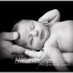Newborn baby with parents hands newborn with mom and dads hands
