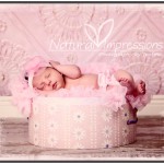 Newborn baby girl in hat box newborn baby girl