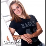 Senior girl with ladder senior girl studio picture