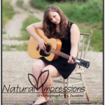 Senior girl with guitar on country road senior girl with guitar